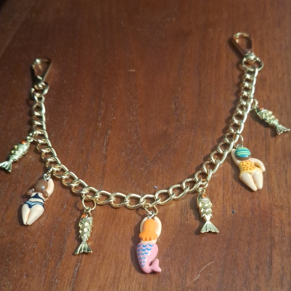 Whimsical Gold Bag Charm Water Theme with Colorful Figures And Fish